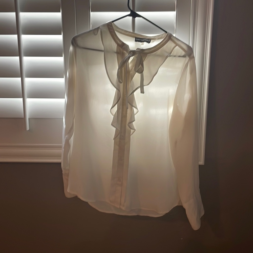 Sheer off white work blouse with ruffle embellishment and tie neck
